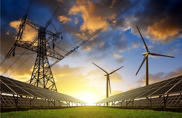 Electricity transmission tower, wind turbines and solar panels