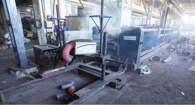 Heated metal component positioned in industrial heating equipment
