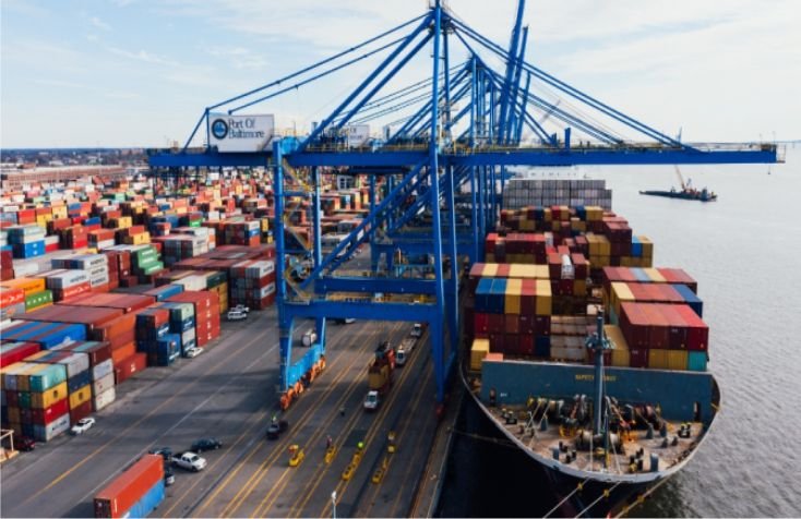 Cargo vessel at a port with container-handling equipment