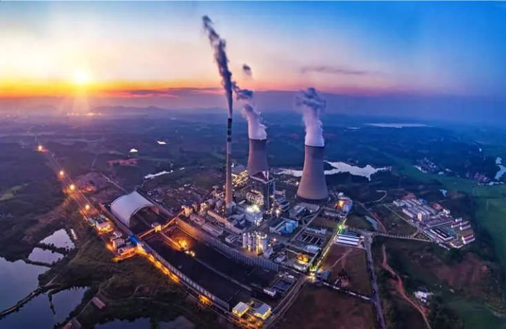 Power-generation site with cooling towers and industrial buildings